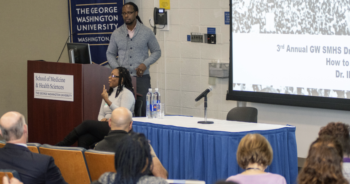 Ibram X. Kendi speaking in a lecture hall