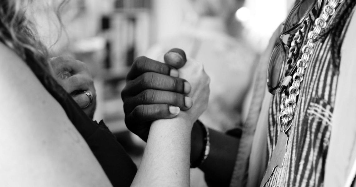 close-up of two people shaking hands